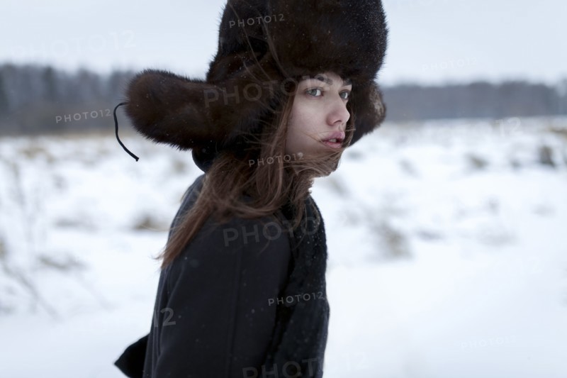 Serious Caucasian woman wearing fur hat and coat in winter
