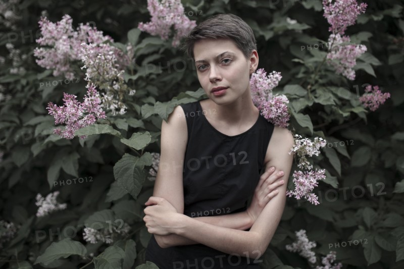 Caucasian woman standing in flowers