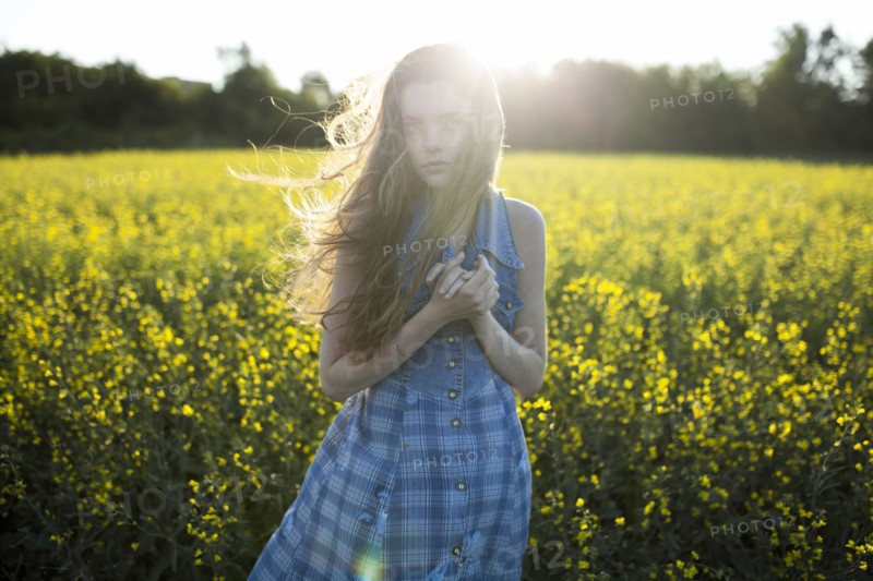 Portrait of Caucasian woman standing in windy field