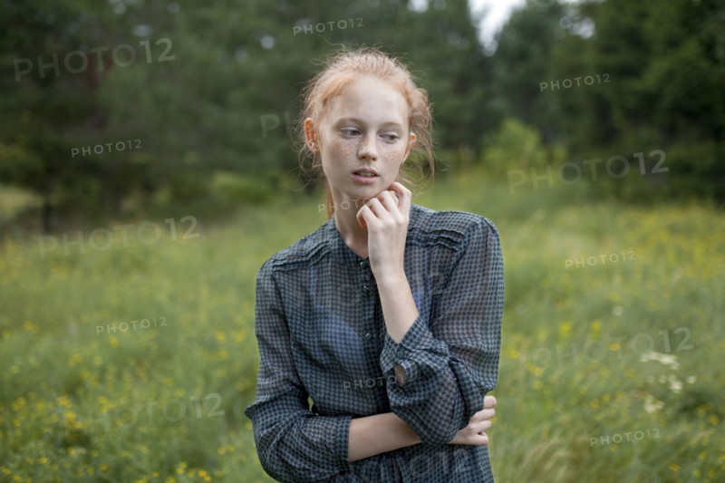 Portrait of Caucasian girl standing in field