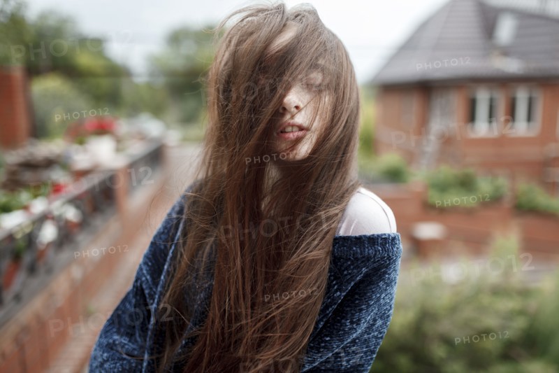 Wind blowing hair of Caucasian girl