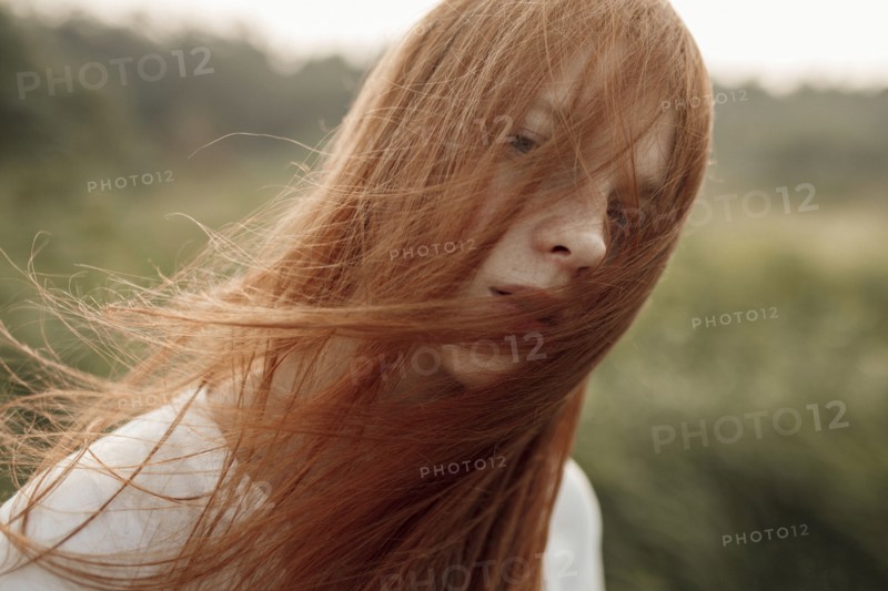 Close up of wind blowing hair of Caucasian woman
