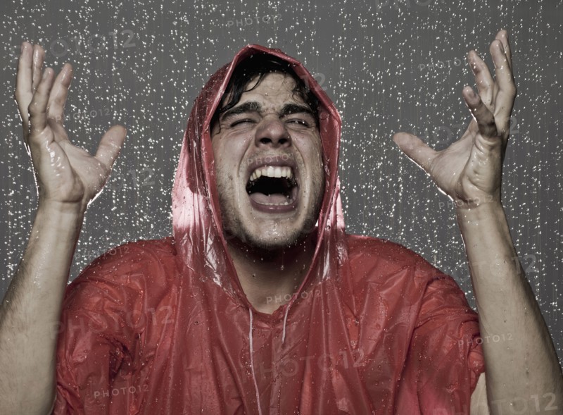 Caucasian man caught in the rain