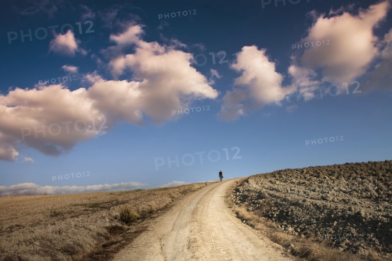 Man walking on dirt road