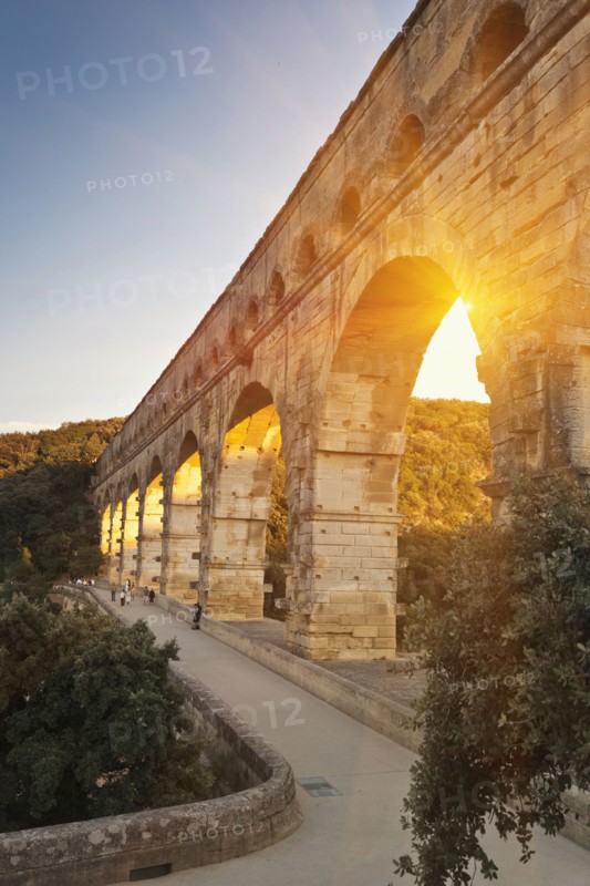 Sun shining through aqueduct