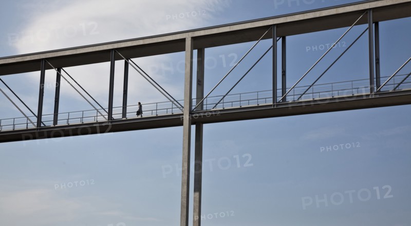 Woman walking on skybridge