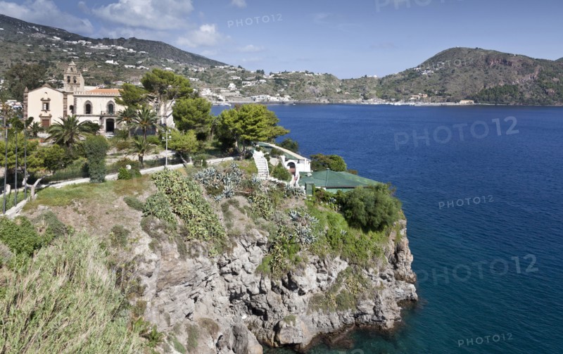 Building on cliff overlooking ocean