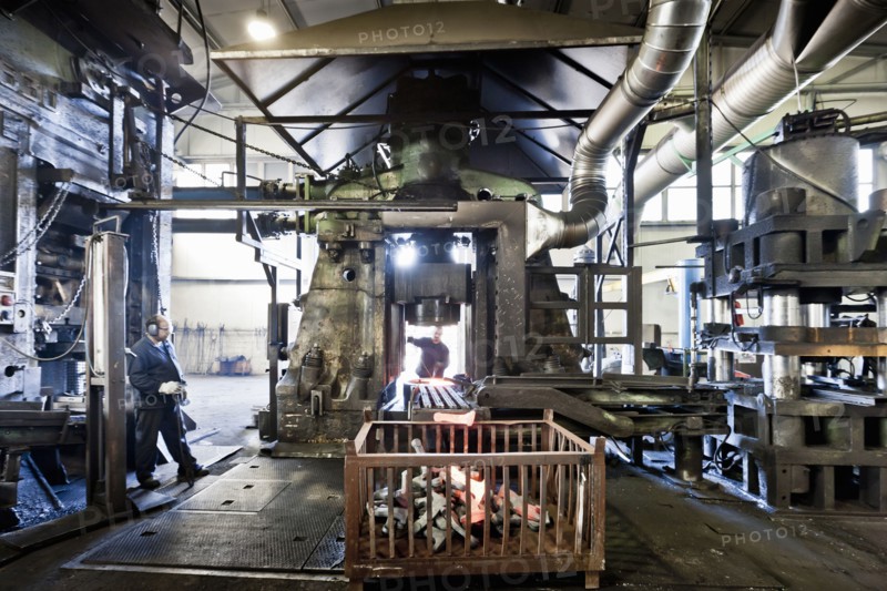 Workers in industrial steel factory