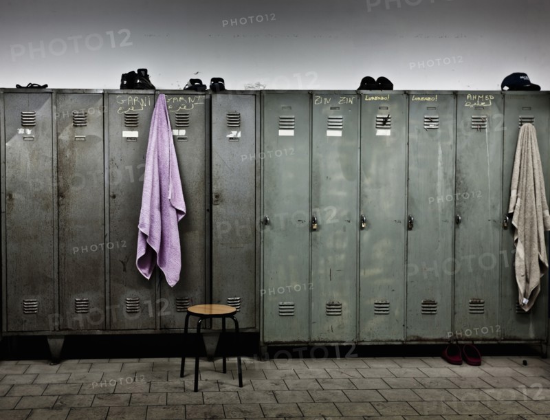 Towels hanging from lockers in locker room