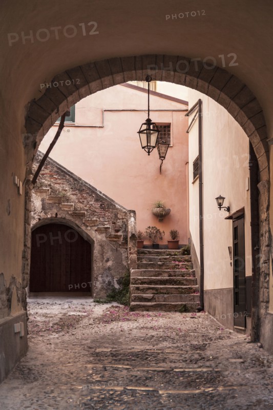 Stone archway to courtyard and steps