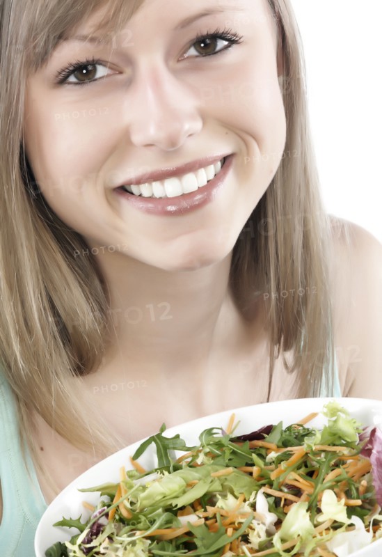 Hispanic woman eating salad