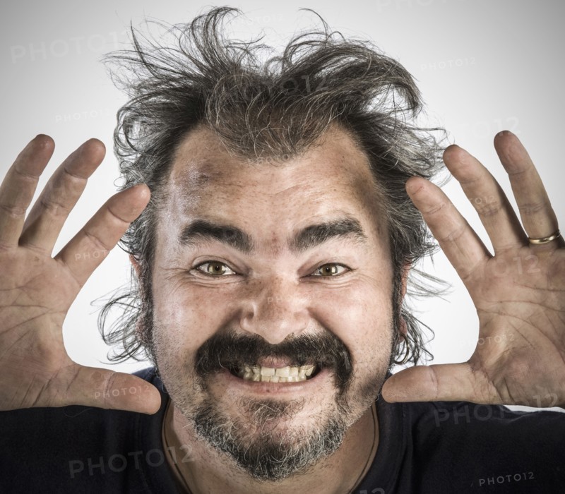 Man with messy hair making face