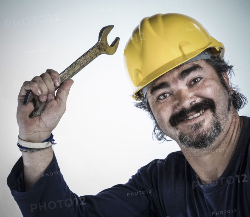 Construction worker holding wrench