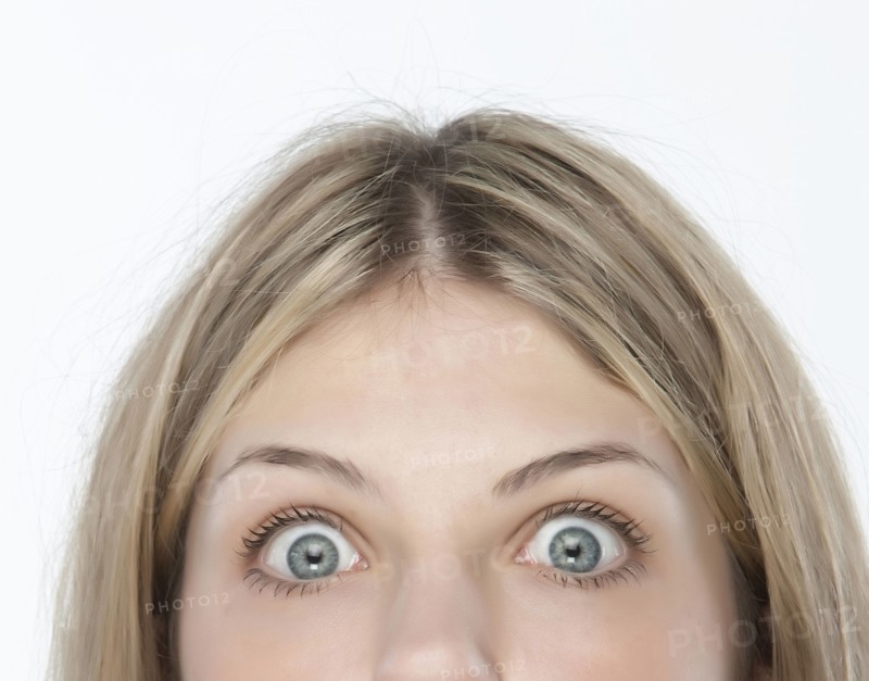 Close up of woman's eyes wide open