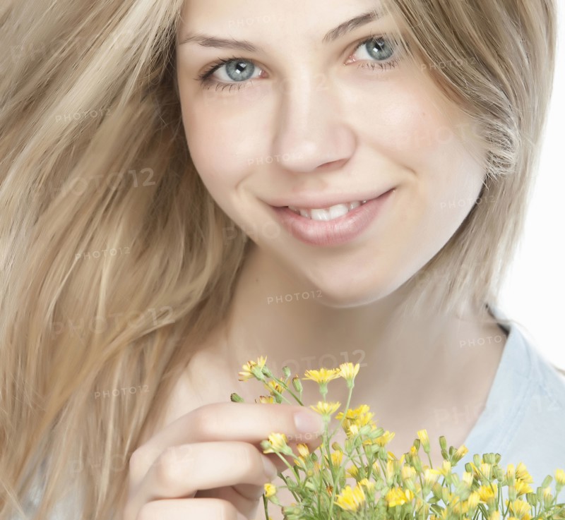 Smiling woman holding bouquet of flowers
