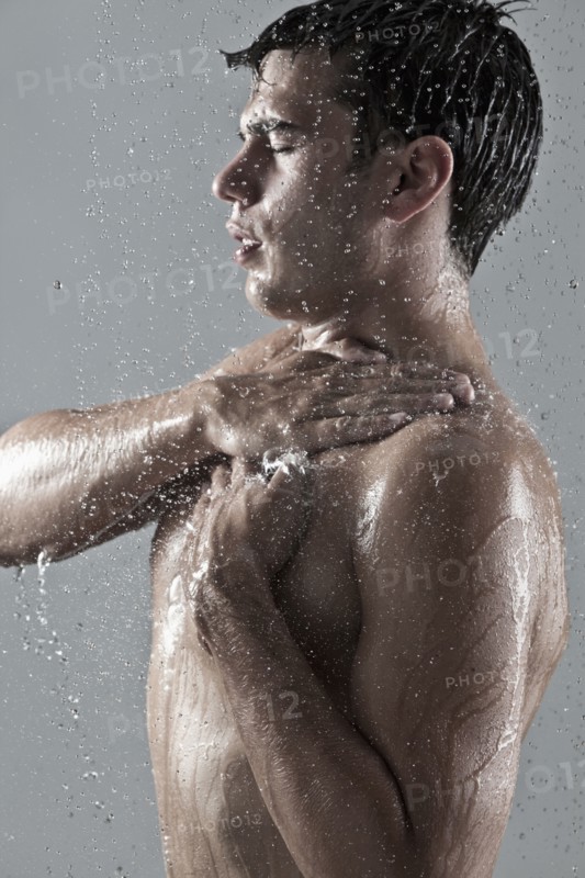 Caucasian man showering