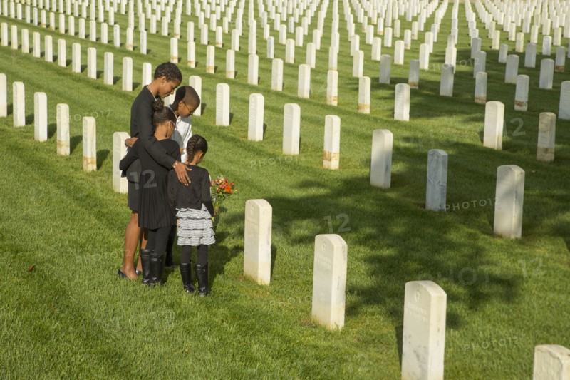 Black family at military cemetery