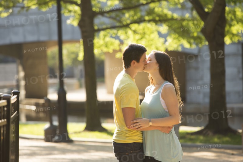 Caucasian couple kissing in park