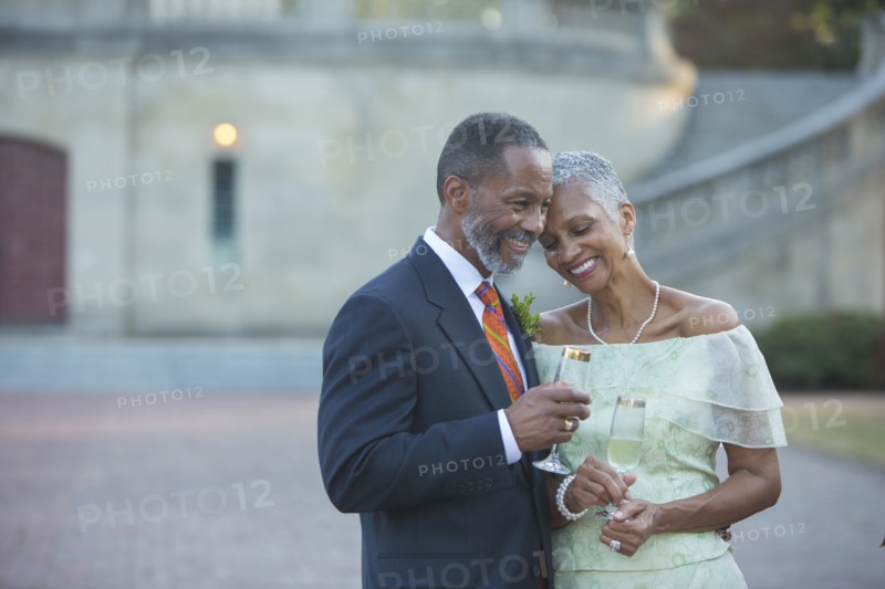 Black couple drinking champagne