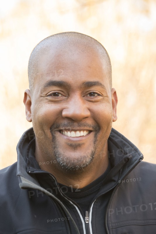 Close up of smiling Mixed Race man