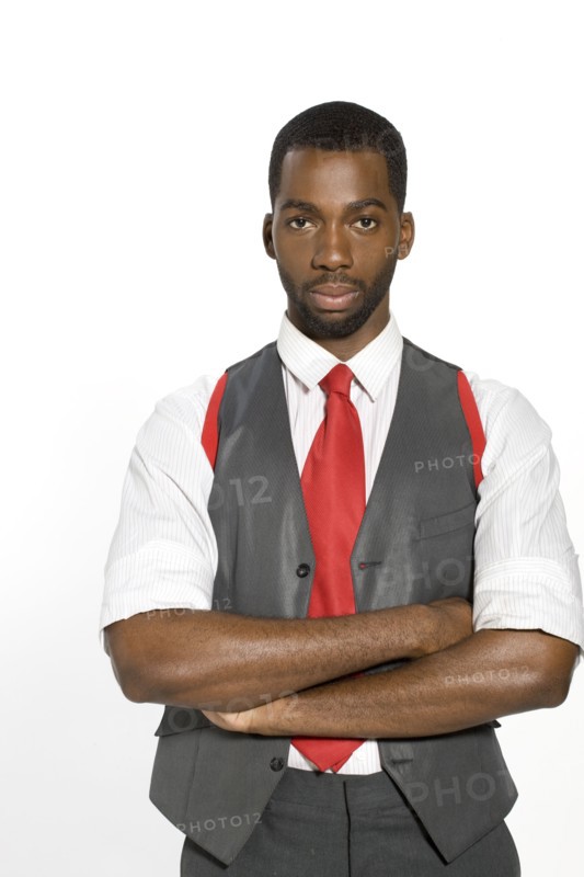 Well-dressed African man with arms crossed