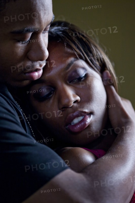 African couple hugging passionately