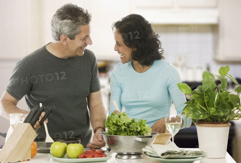 Couple cooking in kitchen