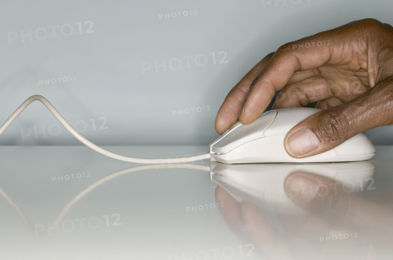 Close up of hands on computer mouse