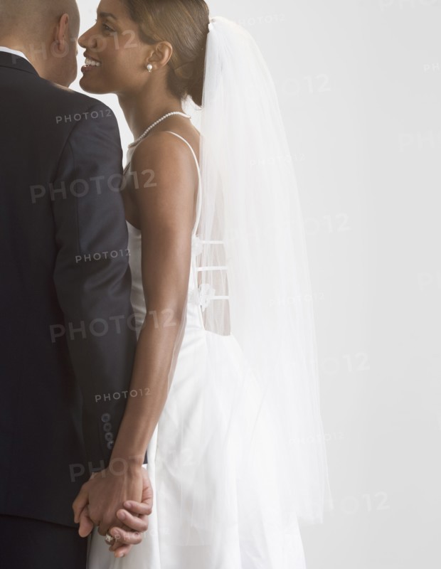 Bride and groom holding hands