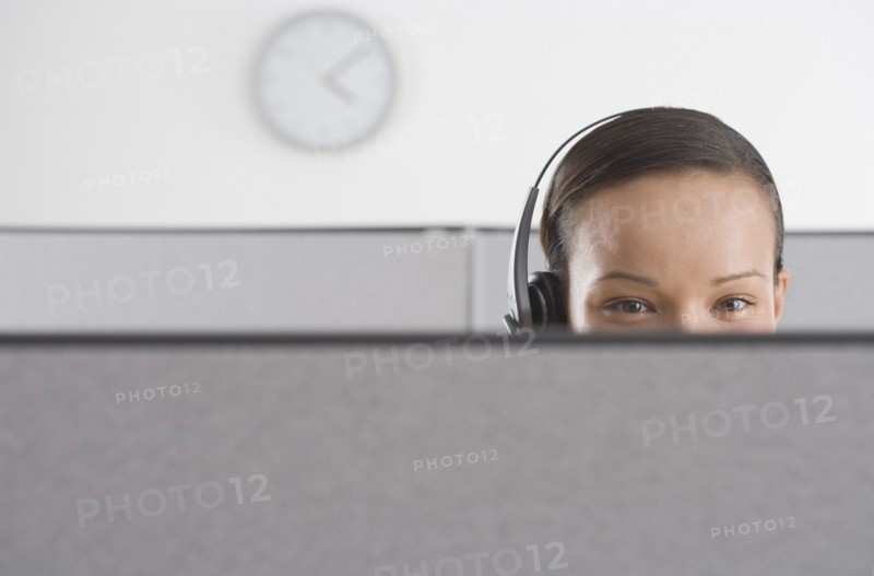 Upper section of woman's head in office