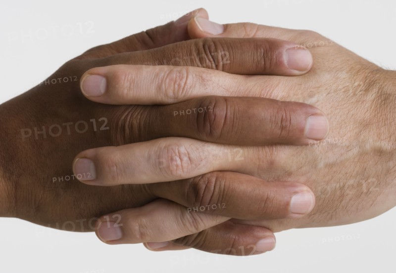 Close up of two hands interlocking
