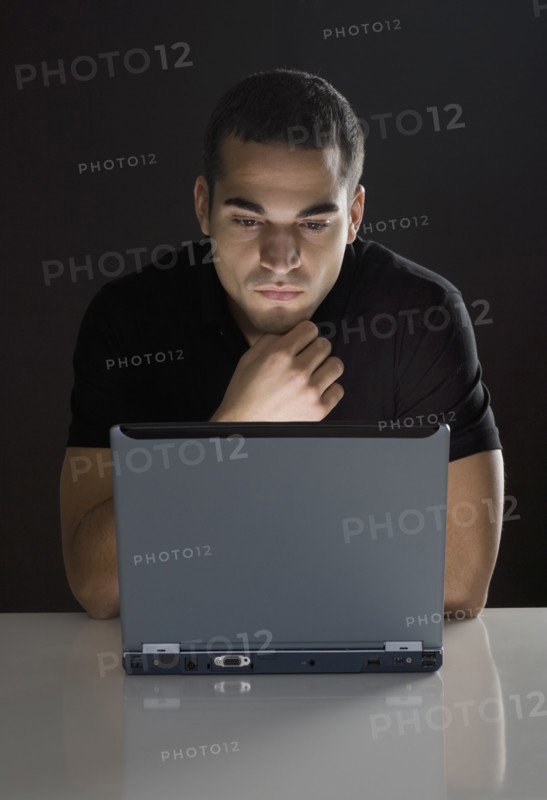 Man in front of laptop
