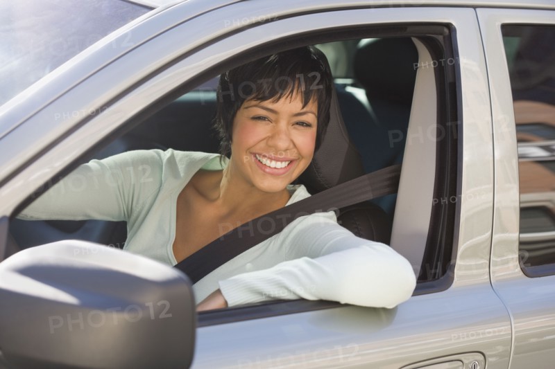 Portrait of woman sitting inside car