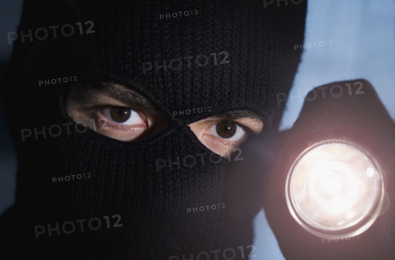 Thief shining his flashlight