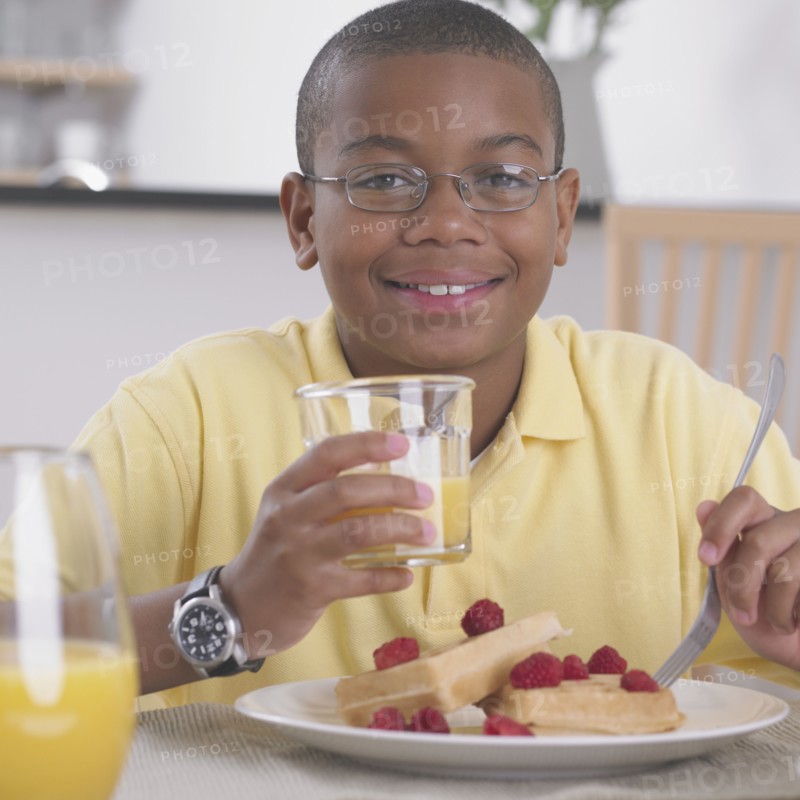 African boy eating breakfast