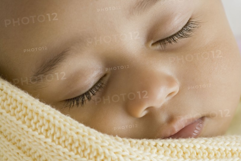 Close up of Hispanic baby sleeping