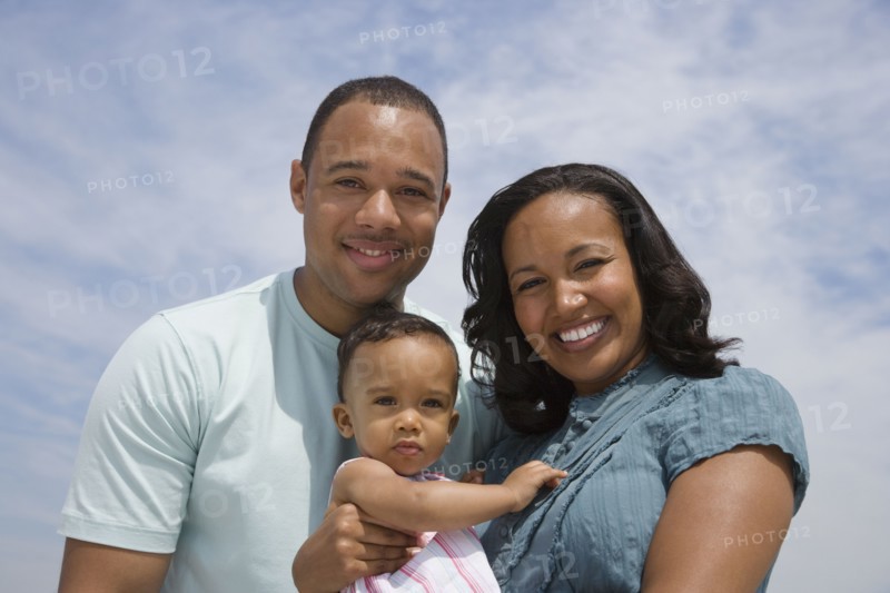 African American parents and baby outdoors