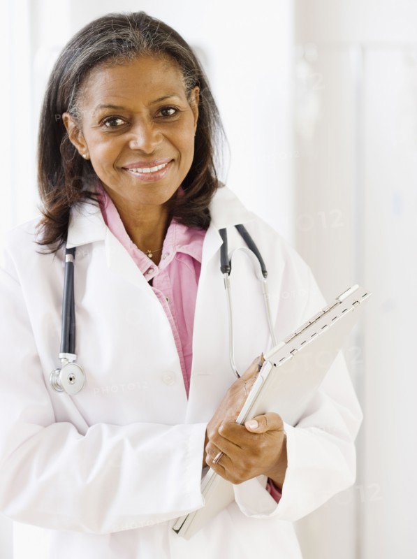 African doctor standing with medical chart