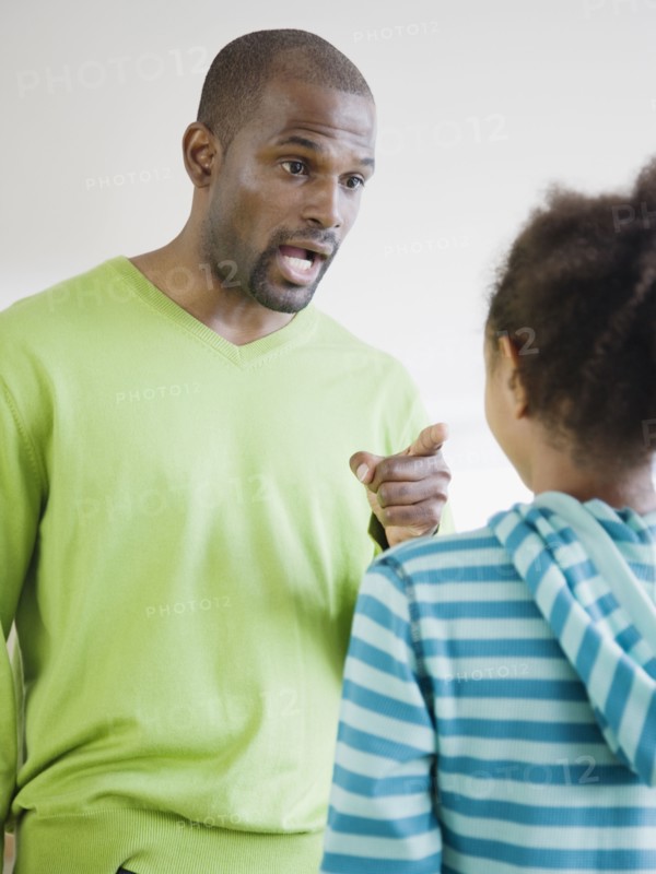 African father scolding daughter