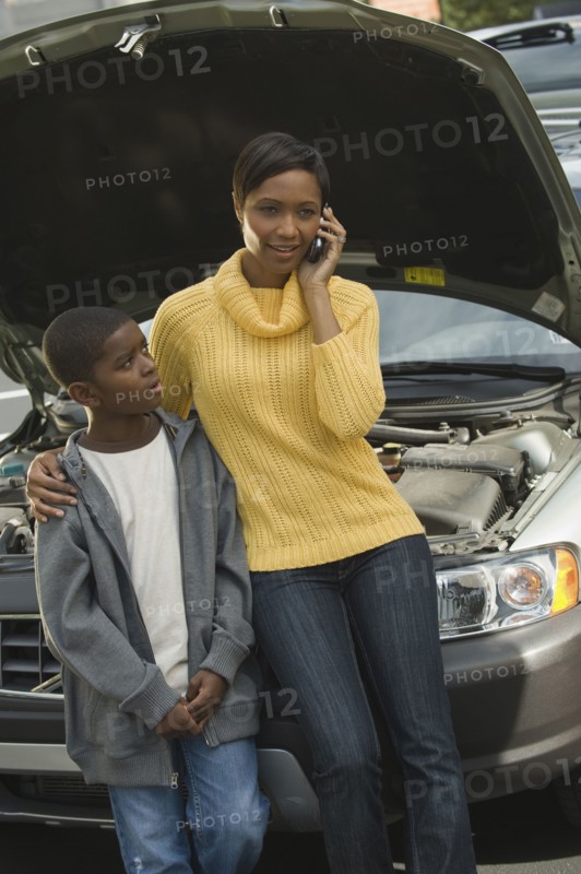 African mother and son having car trouble
