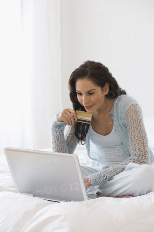 Hispanic woman shopping online