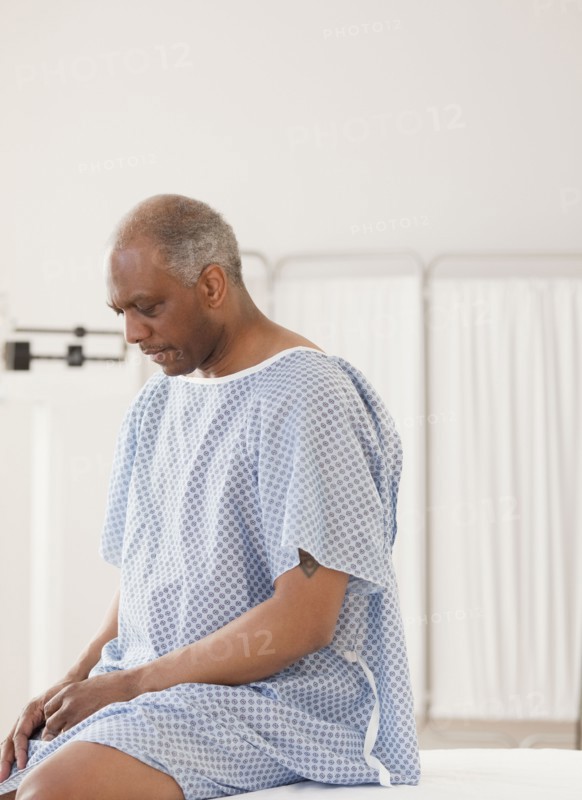 African man waiting for doctor in hospital
