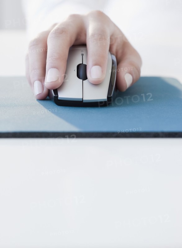 Woman clicking on computer mouse