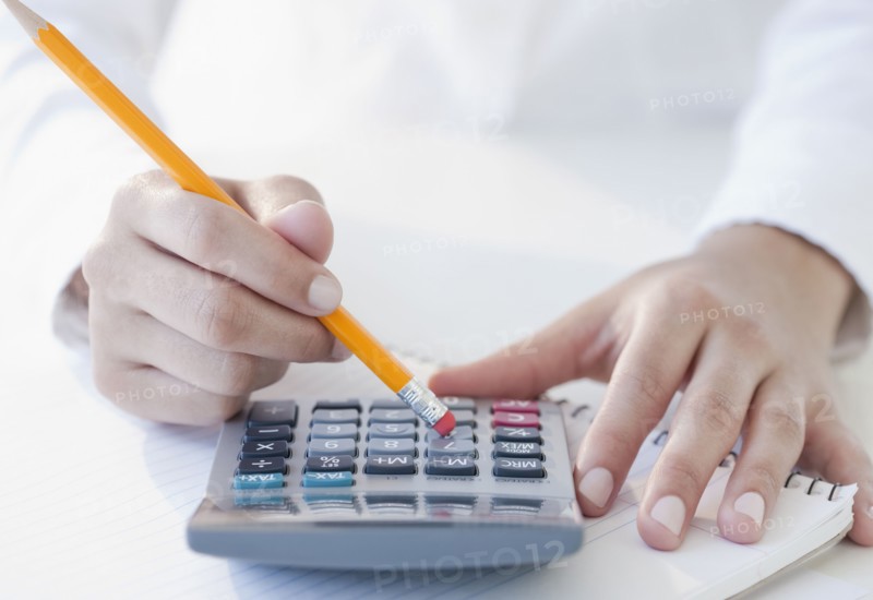 Woman using calculator