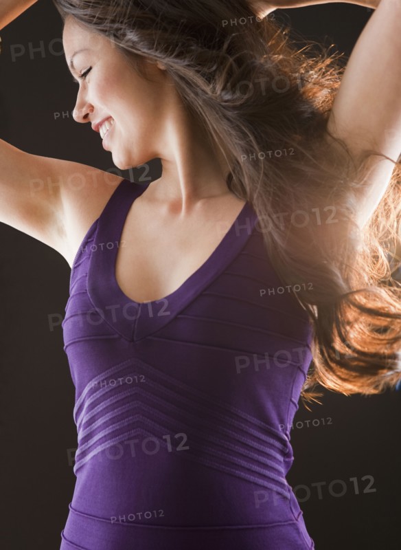 Mixed race woman dancing