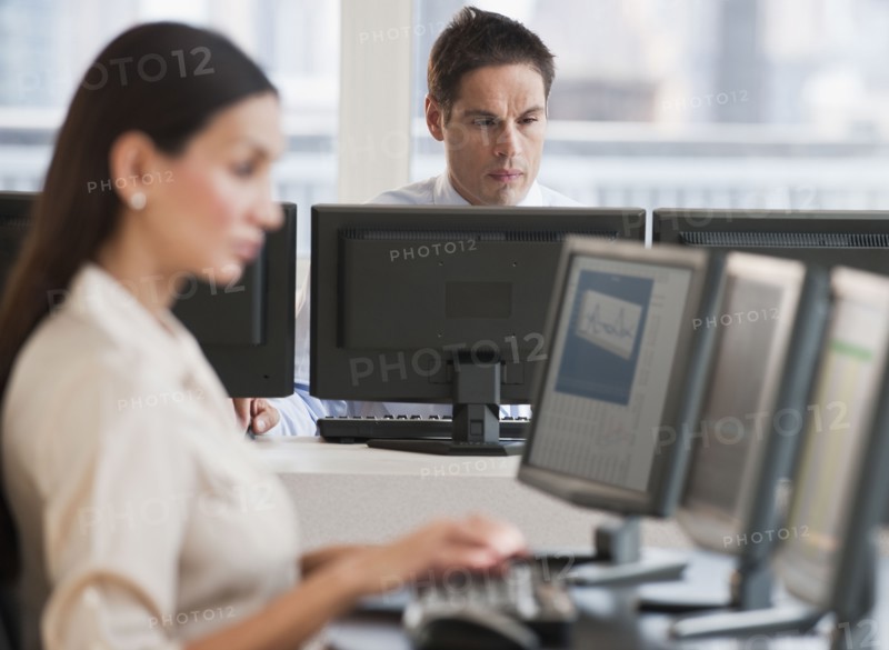 Hispanic businessman working on computer