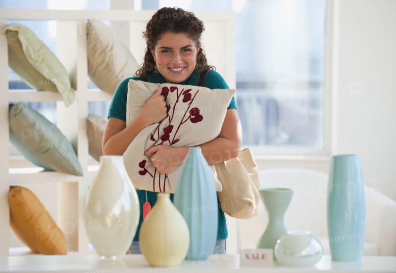 Mixed race woman shopping for pillows