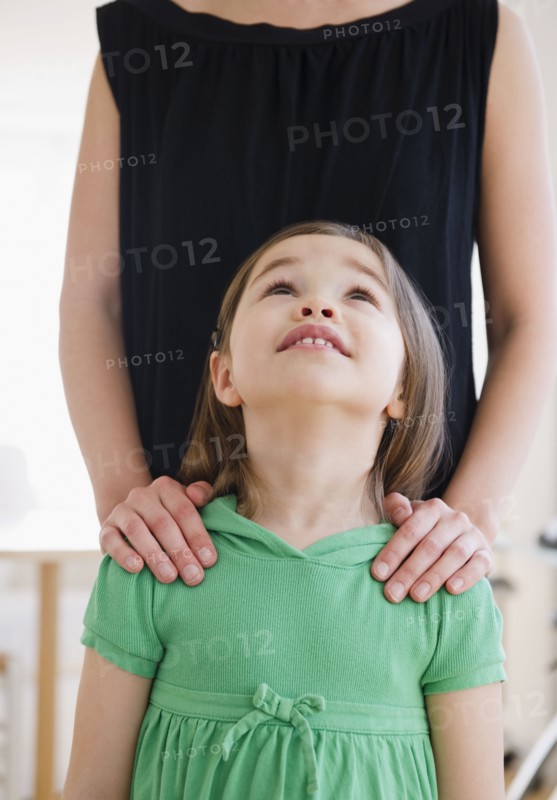 Mixed race girl looking at mother