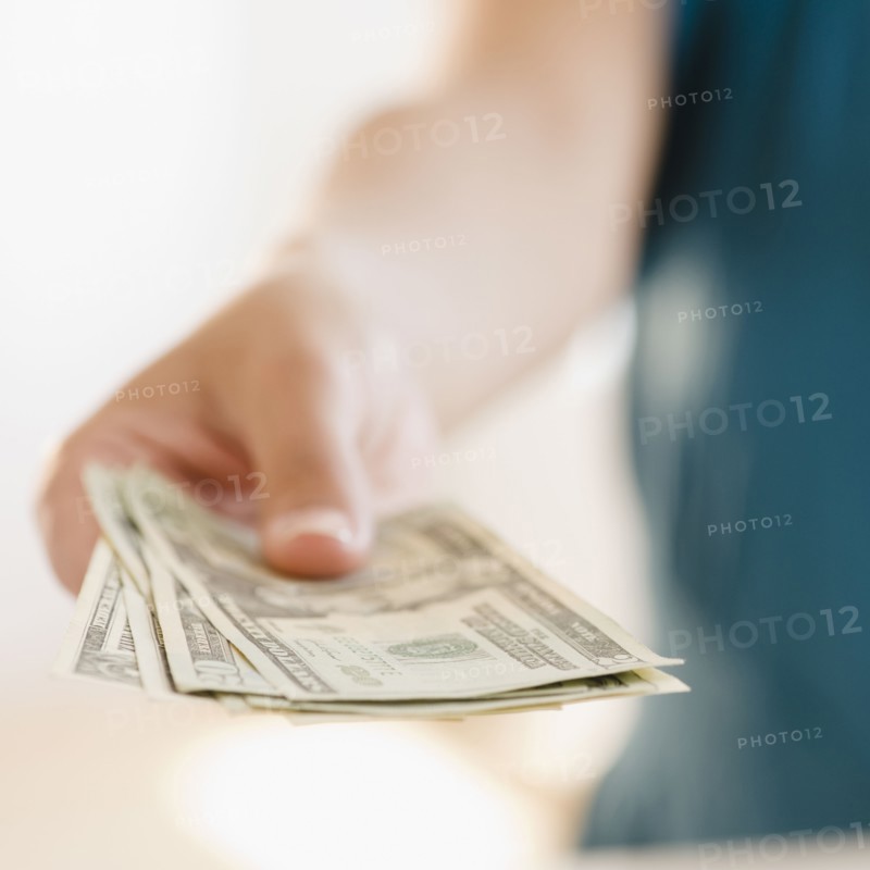 Hand holding money