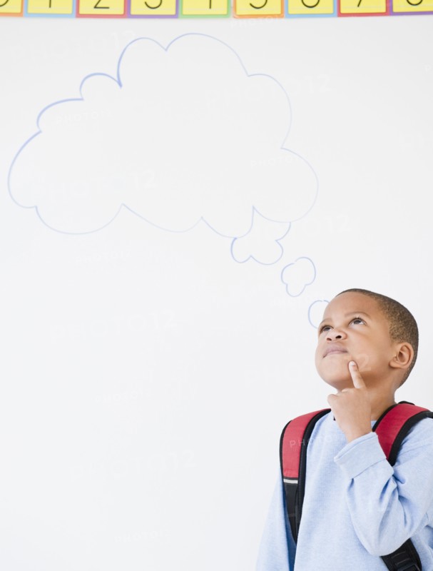 African American boy in school with thought bubble